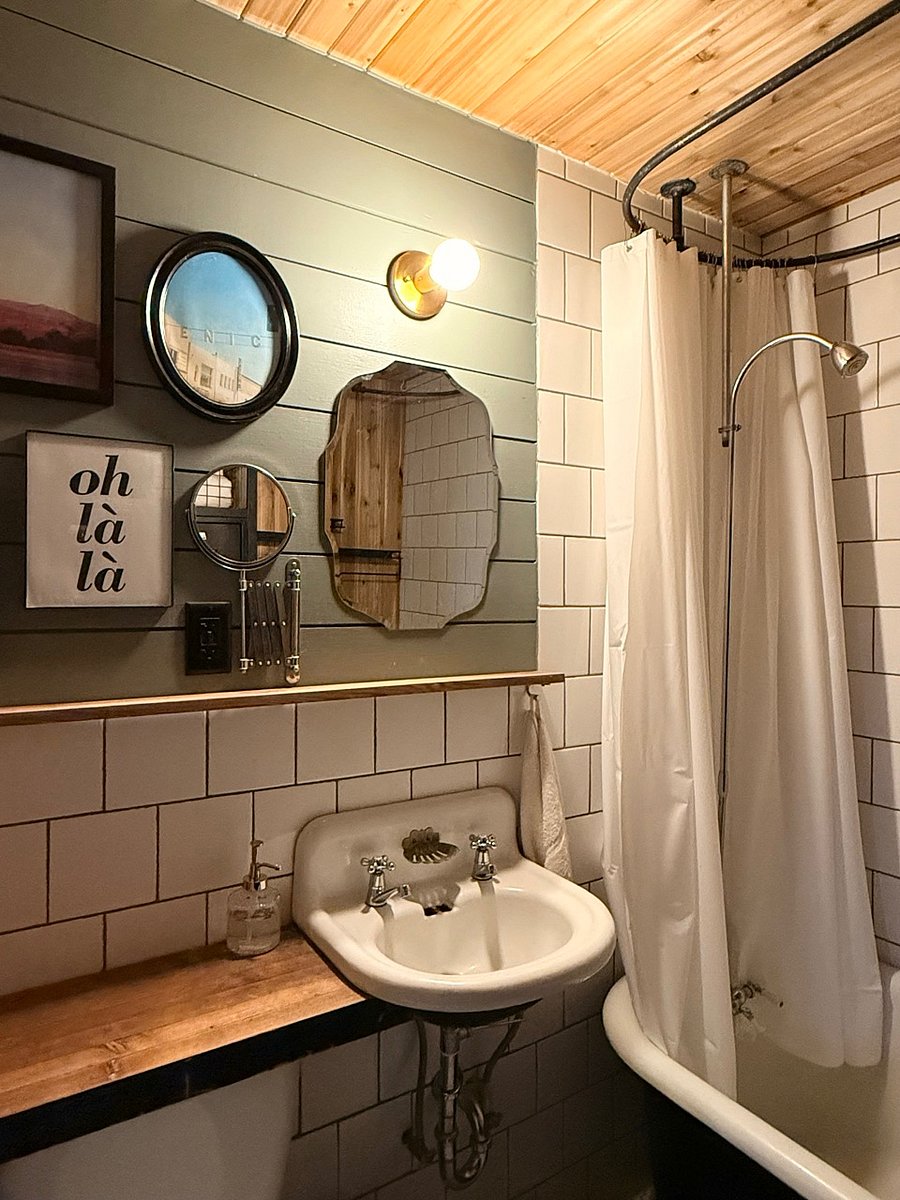 Bathroom - claw foot tub/shower, lockers for storage, toilet, sink, heated tile floor