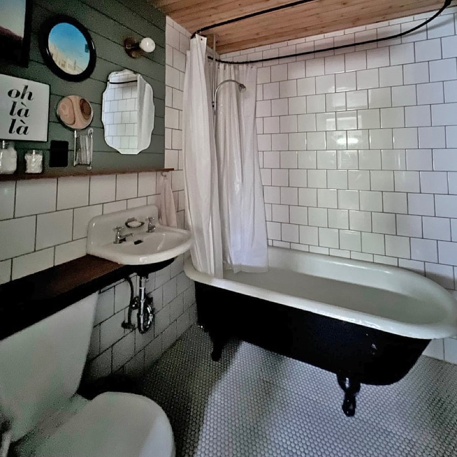 Bathroom - claw foot tub/shower, lockers for storage, toilet, sink, heated tile floor