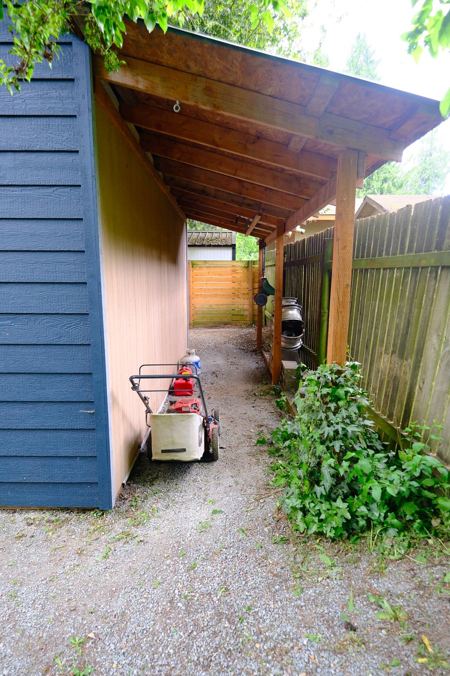 Behind the shed in backyard