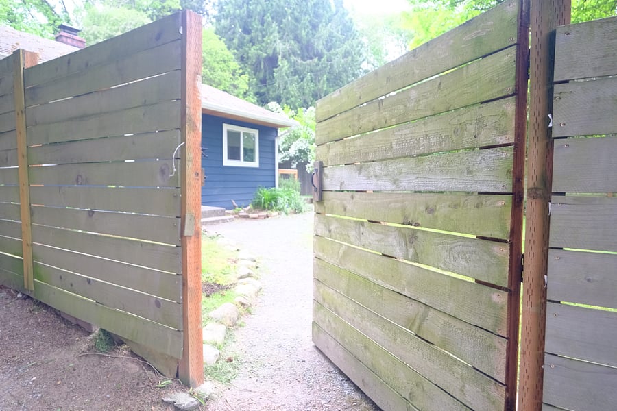 Gate to front yard off to the right of the driveway