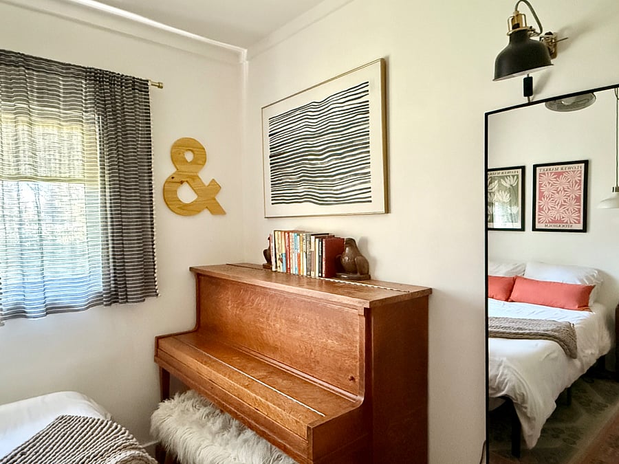 Guest Room - front yard facing, full bed with space under  for luggage storage, small closet, dresser, working piano (out of tune)