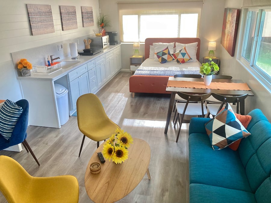 Kitchenette includes:
- Countertop conventional oven
- Induction cooktop plates
- Garbage Disposal
- Deep kitchen sink
- Microwave
- Coffee Machine (Keurig)
- Fridge
- Utensils
- Plates, cups, mugs