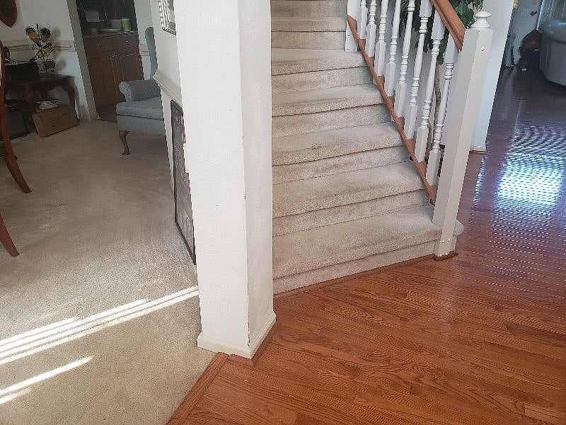 Dining room entry to the left of stairs