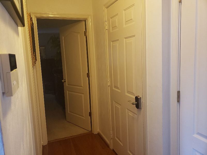 Hallway leading to bath, bedroom, laundry room and potential private entrance.