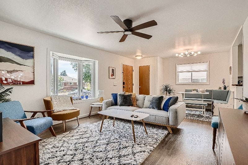 Living room and dining nook, with all new furnishings and fresh open-concept layout.