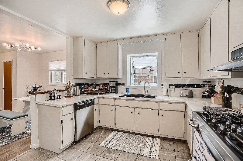 Large, fully-stocked kitchen.  5-burner gas range and double oven for elaborate meals!  Garden box windows provide gorgeous sunlight, especially during sunset. 