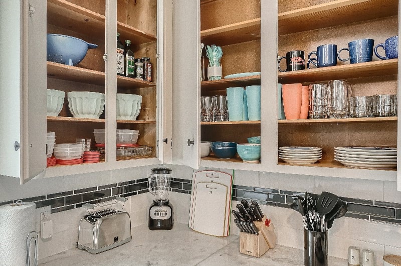 Abundant supply of bowls, pots, pans and other kitchen-ware to facilitate cooking projects of all sizes. 
