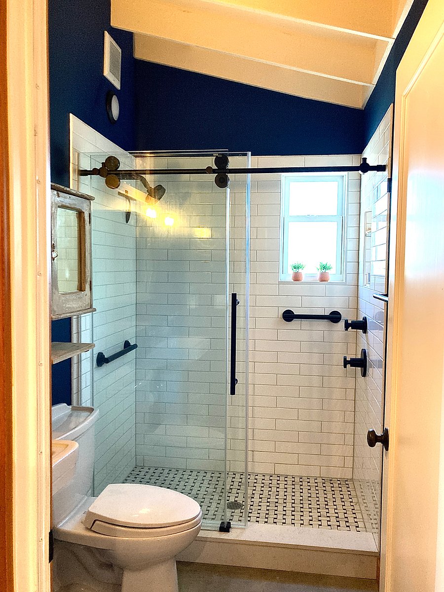 Tiled shower, rain shower head, window for light and air