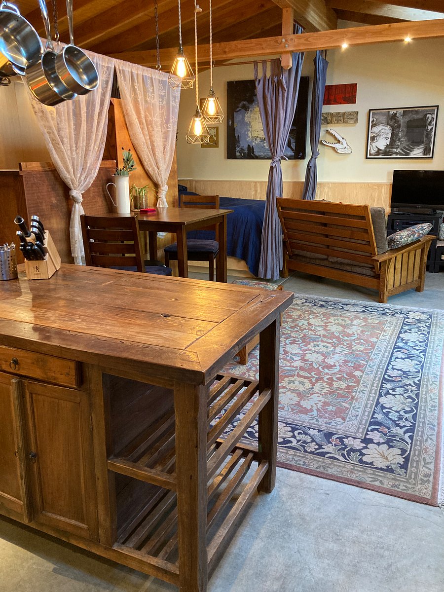 View from kitchen toward work table and loveseat / tv
