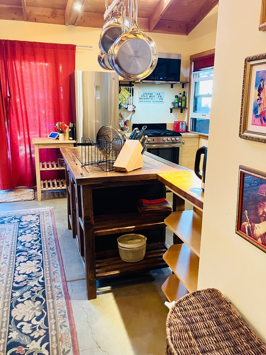 Large teak floor pantry provides cookware, bakeware, and space for your dry goods