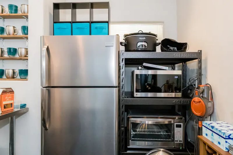 Full size, stainless steel refrigerator and freezer. Convection oven, microwave + crock pot.