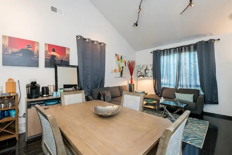 Dining area leads into spacious living room.
