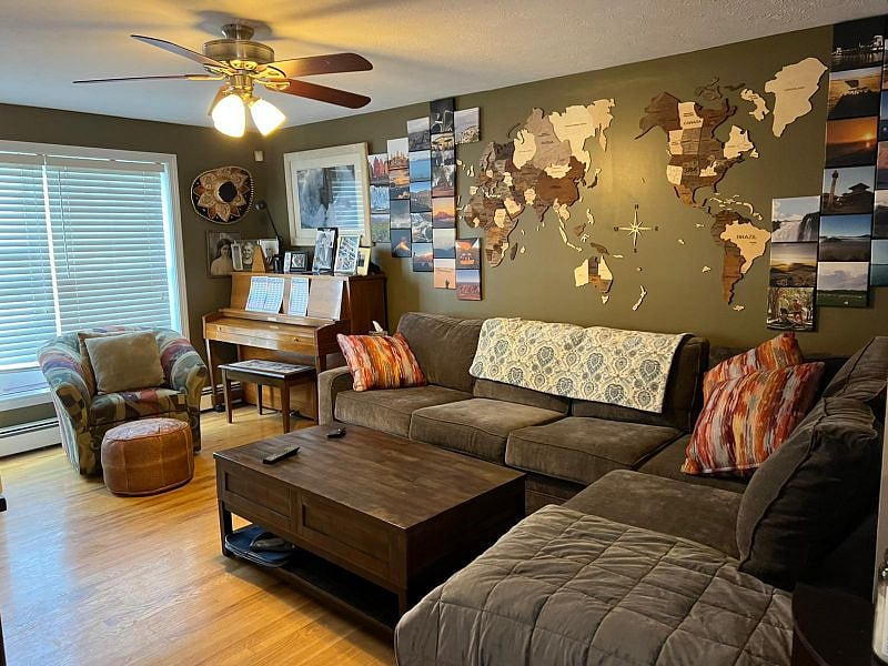 Living Room contains upright piano and pullout queen bed