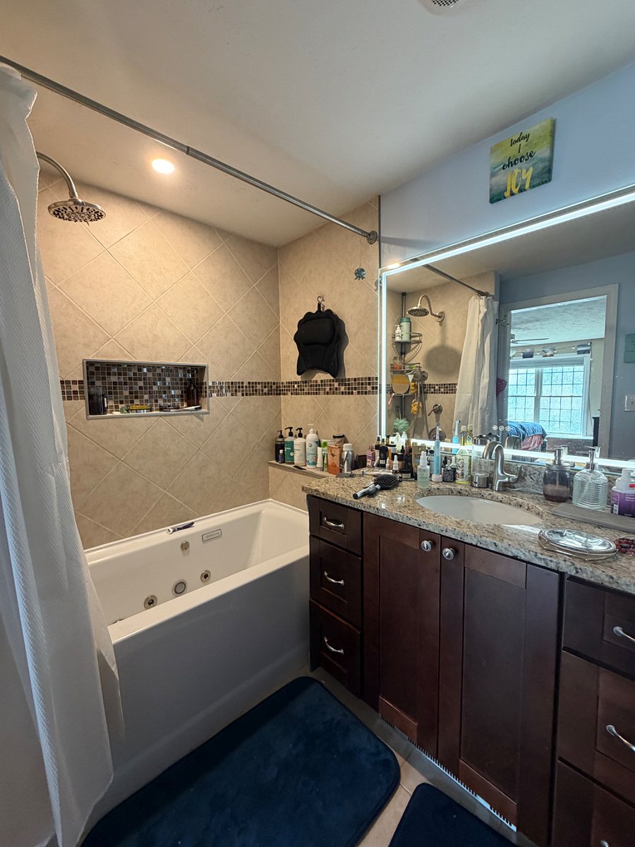 Master ensuite bathroom. Jacuzzi tub pictured. Will be cleared out for your move in