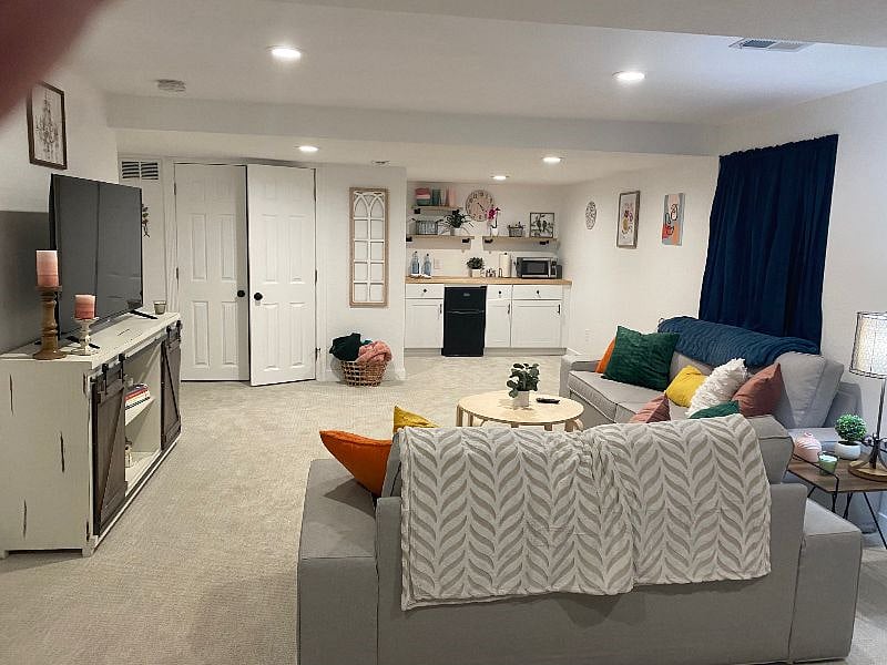 Living space on lower level with laundry and kitchenette
