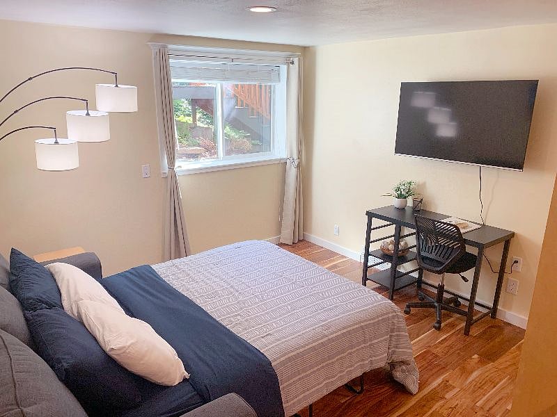 Couch pulls out with a queen-size mattress for guests