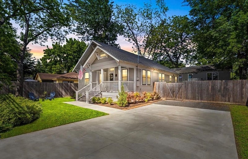 Front view of main house (owner-occupied).  Guest will have a designated parking space on the right side of the gated driveway.  