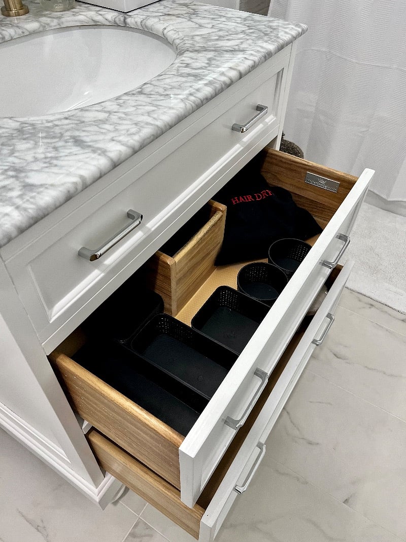 Hair dryer, mini straightener, and bath vanity organizers.
