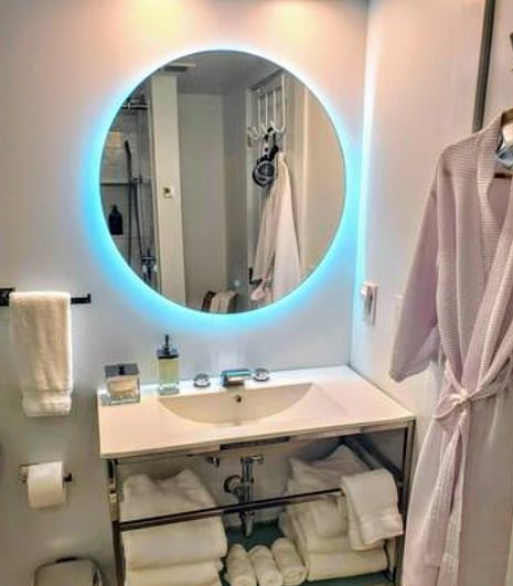 Spa ambience in the bathroom. Backlit mirror with anti-fog, plenty of sumptuous white towels, heater, and hotel quality robes.