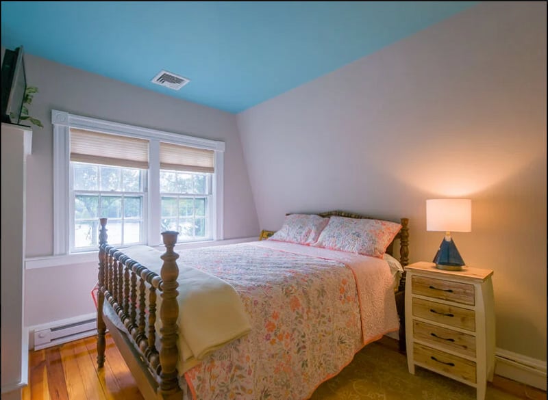 Bedroom 1 with double bed and view of canal
