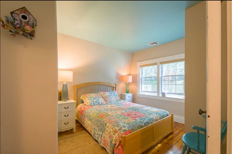 Bedroom 2 with queen bed and view of canal