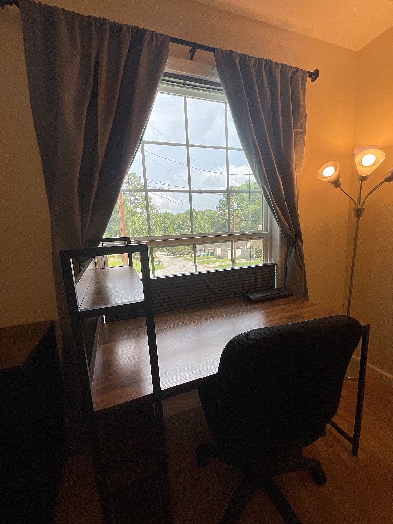 Desk/workspace with gorgeous street view. Blackout blinds and curtains.