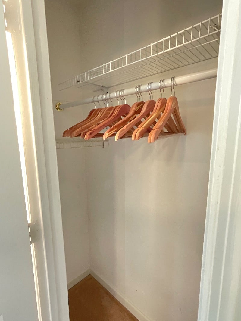 Spacious closet with cedar hangers.