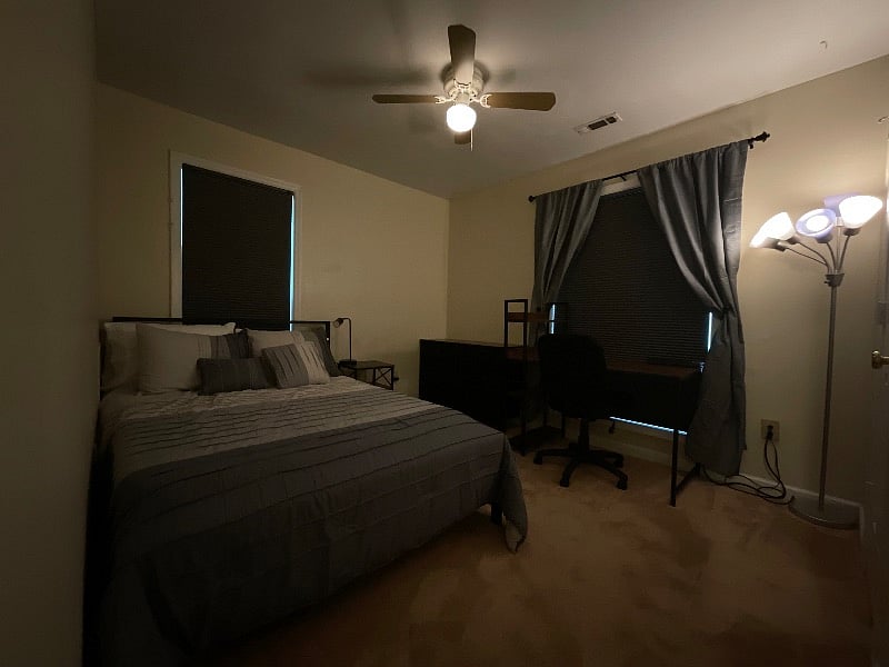 During the day with blinds closed and lights dimmed. Dimmer switch on wall controls overhead light and lamp.