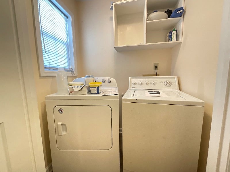 Washer and dryer located right next to bedroom.