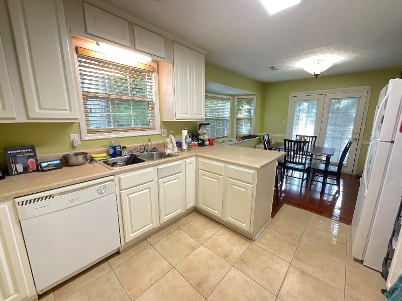 Kitchen and dining view from garage door.