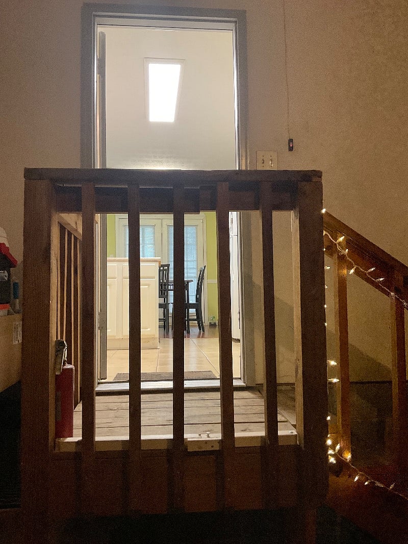 Stairs from garage into kitchen. Side of stairs opens up to easily set groceries, suitcase, etc. on to easily move into house. This is much easier than carrying these things up the stairs.