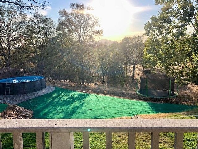 Almost 1 acre property with pool and trampoline