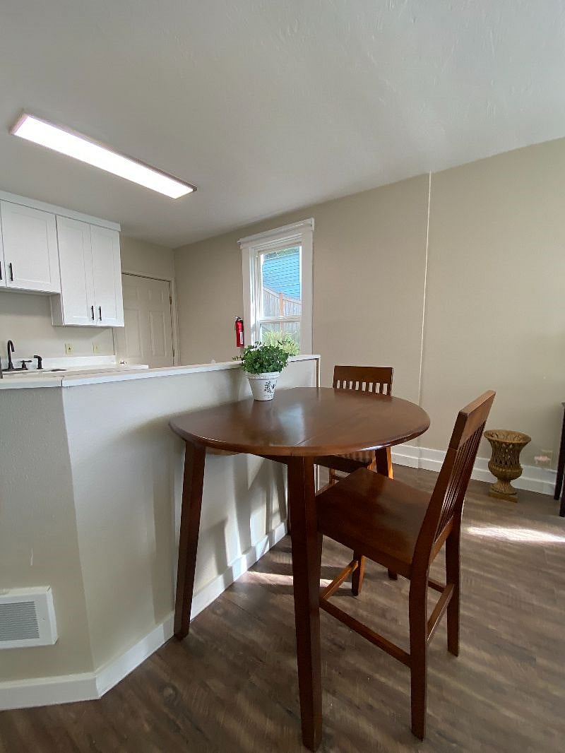 Kitchen table; folds up to serve 4 or down to serve 2/3