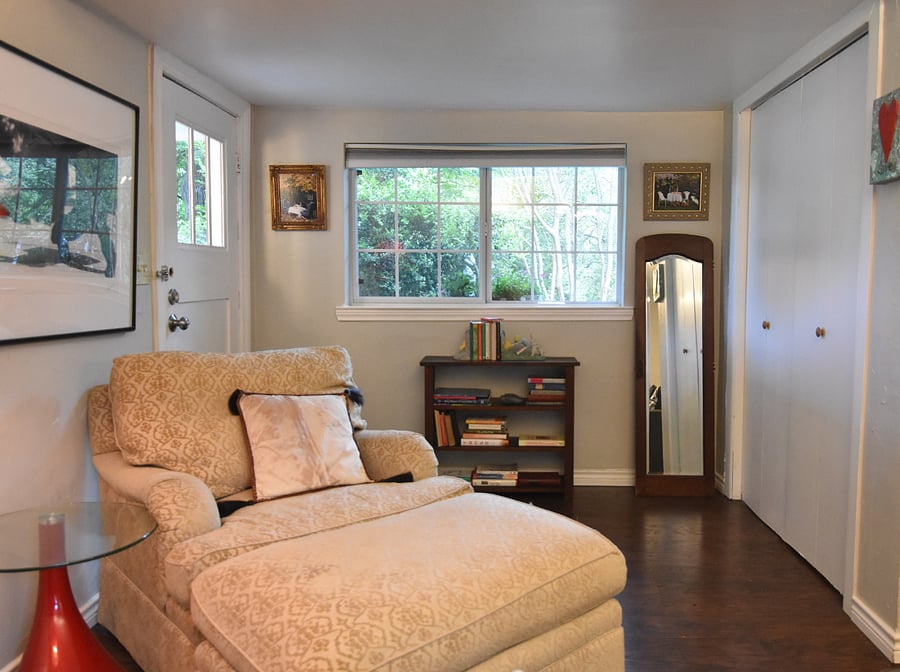 Big comfy chair with ottoman in sitting area