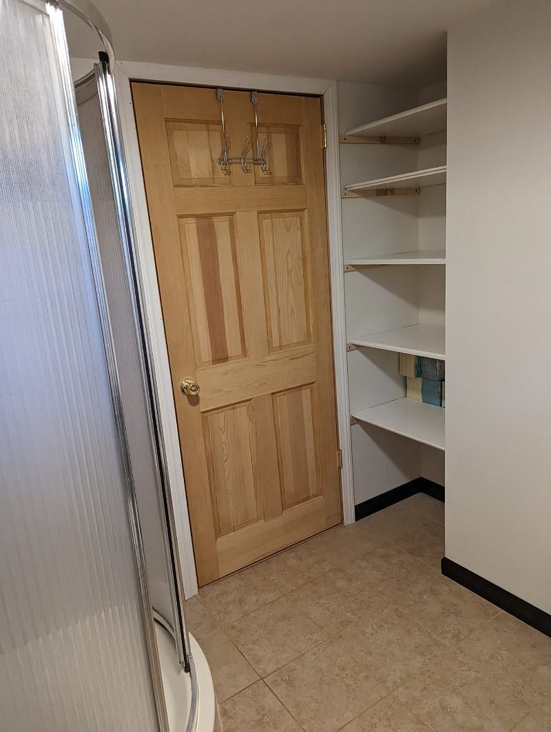 Shower and Linen Closet in Basement Unit