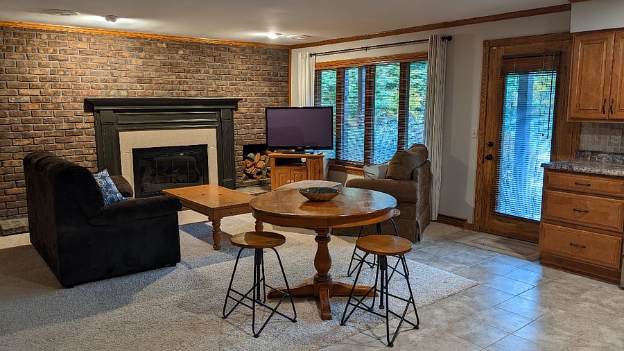 This is the living room in the suite, also showing the entry door (shared by bedrooms 1 & 2).