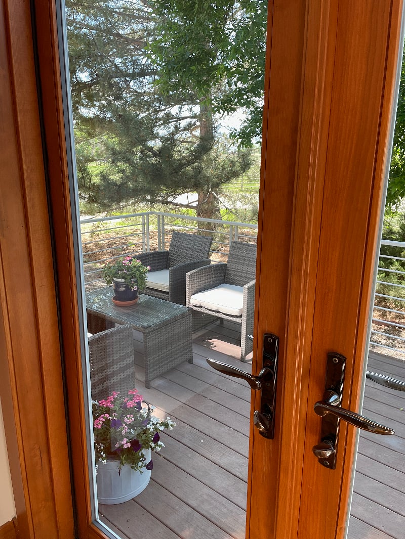 Private entrance with parking in front of the deck.