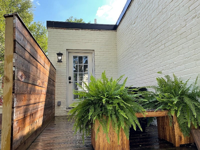 Entrance to carriage house above stairs