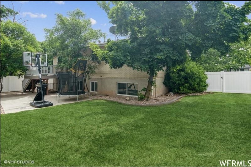 Private, fenced-in backyard great for families during any season.