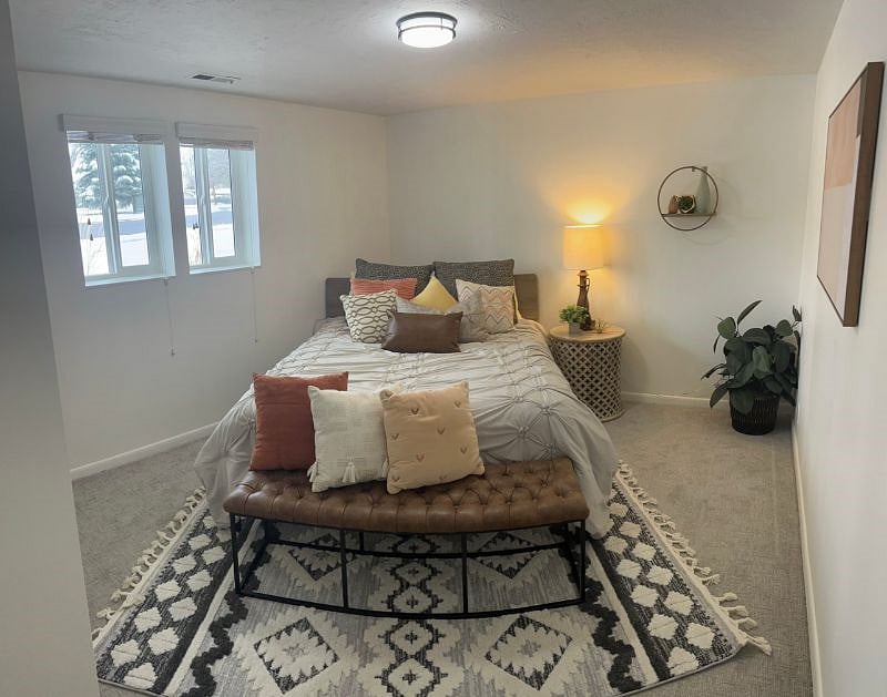 Queen size bed with closet in master bedroom.
