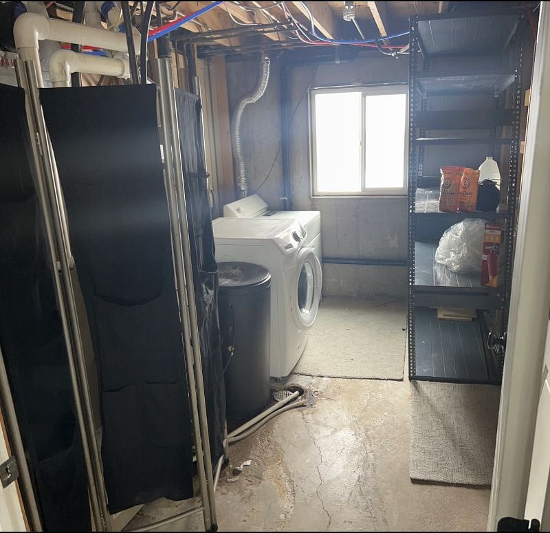 Combined storage and laundry room.