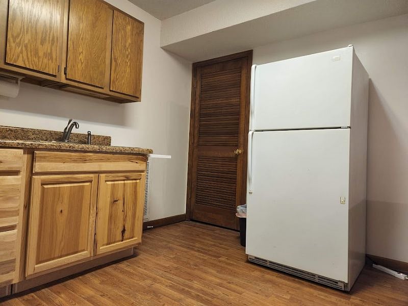 Full-size refrigerator is conveniently located.