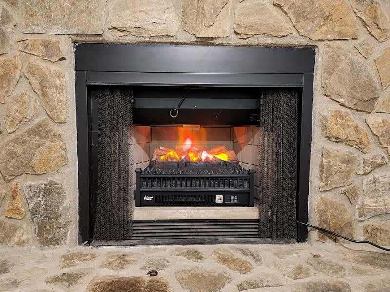 Electric logs add comfy atmosphere.