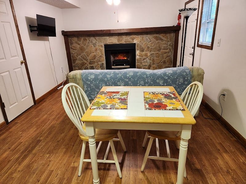 Table with ceramic top and comfortable chairs.