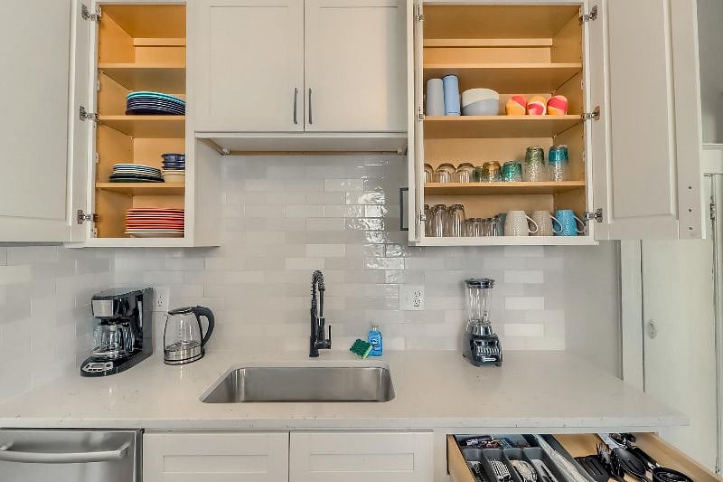 Kitchen with Dishwasher, disposal, plates/bowls, glasses, mugs and utensils 