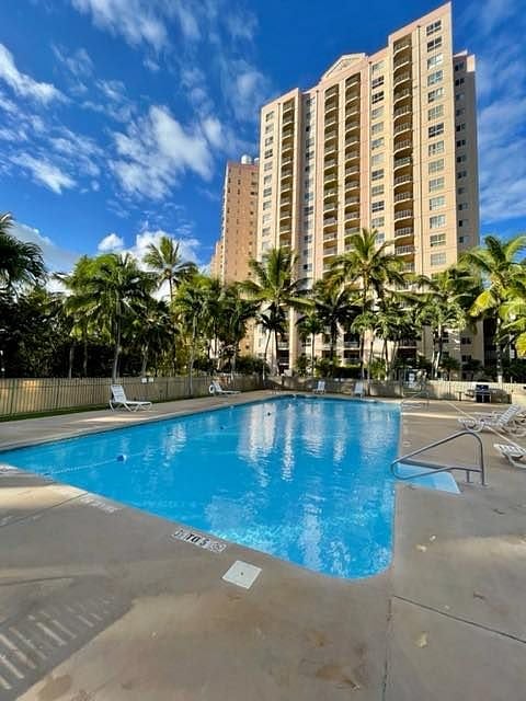 Swimming pool with our building in the background