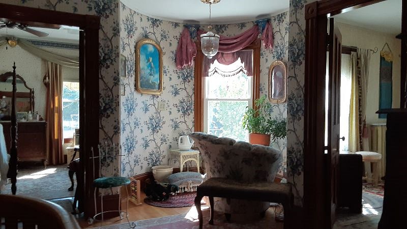 upstairs turret sitting area, bedroom on left, second bedroom on right