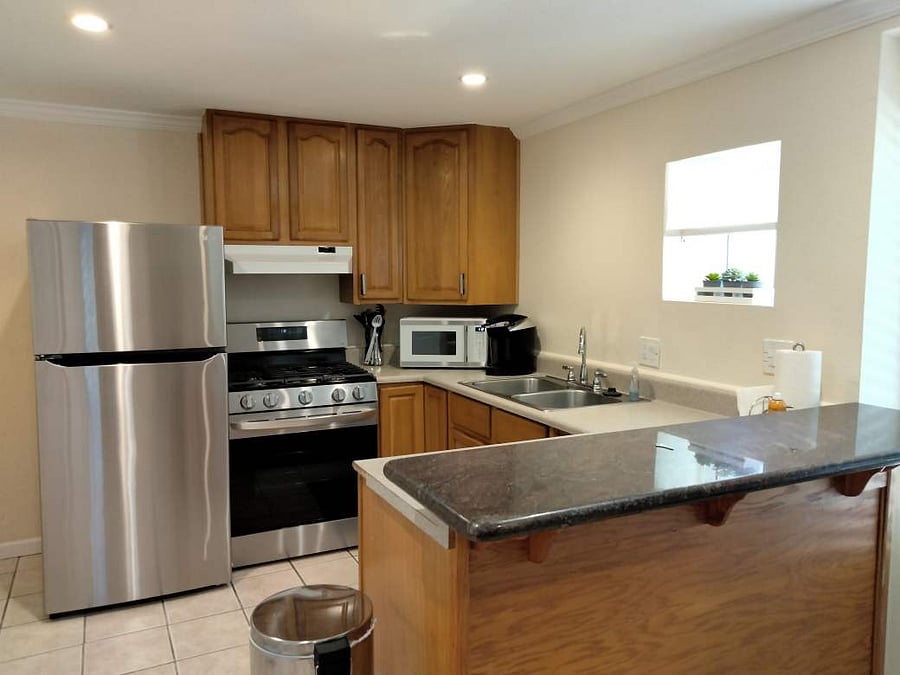 Full sized stove and refrigerator. Garbage disposal, microwave and coffee maker.