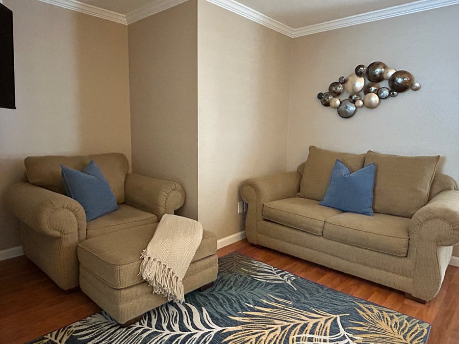 Cozy living room space with wall mounted 50 smart tv.