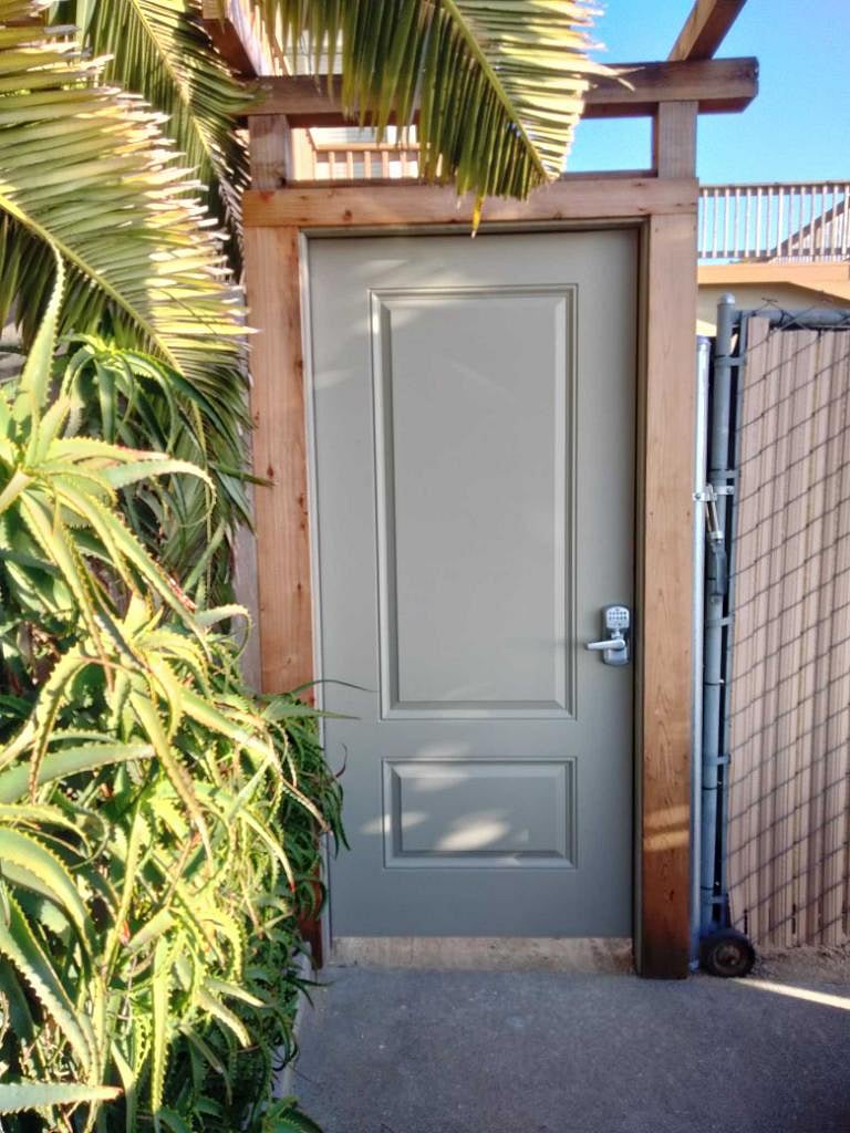 Secure courtyard/apartment entrance with keyless keypad entry.